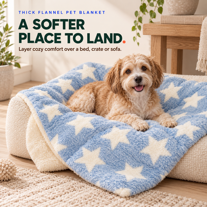 Small dog rests on the Blue stars thick flannel pet blanket layered over a cream dog bed.