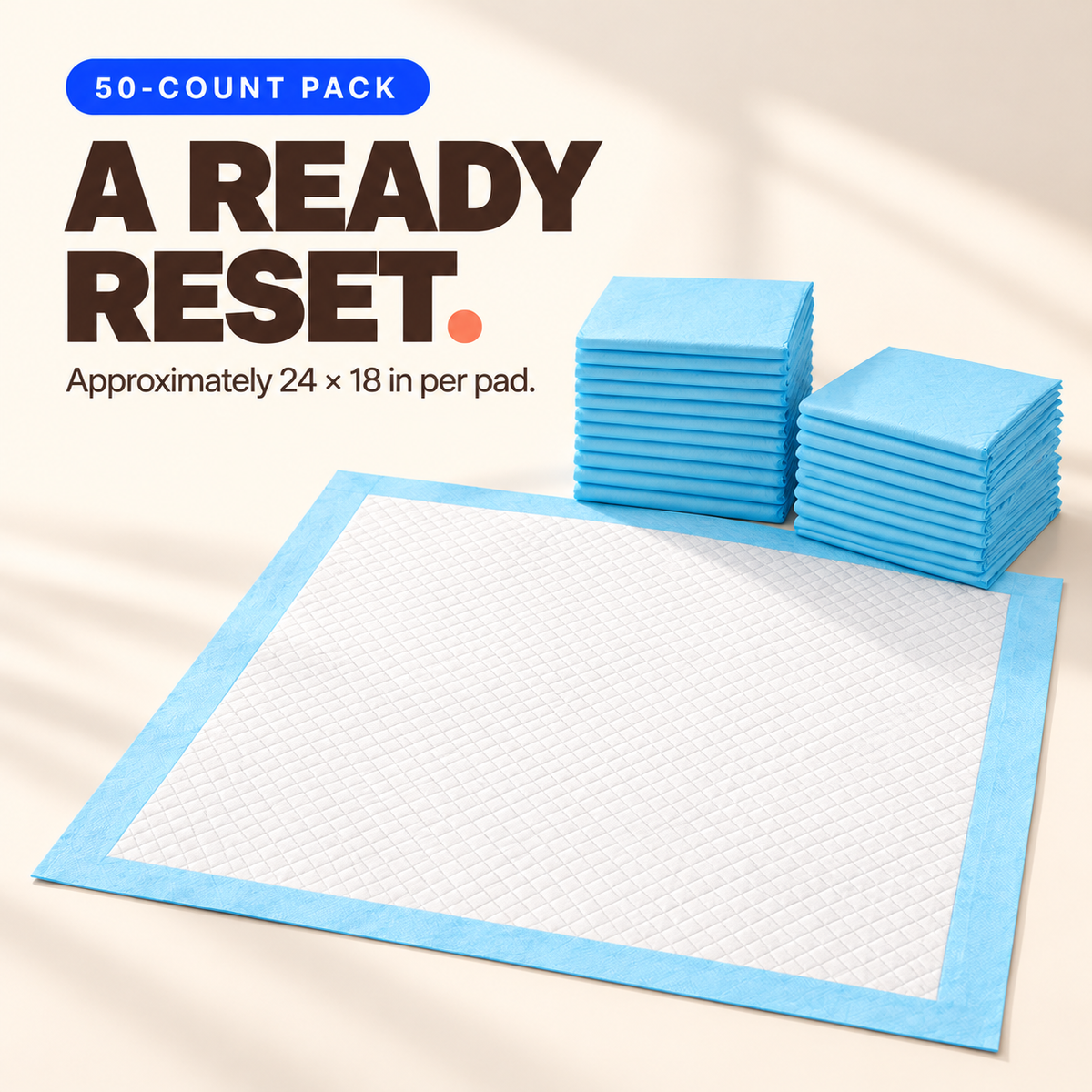 Disposable pet training pad with a white quilted top, blue border, and stacks of folded pads from a 50-count pack.