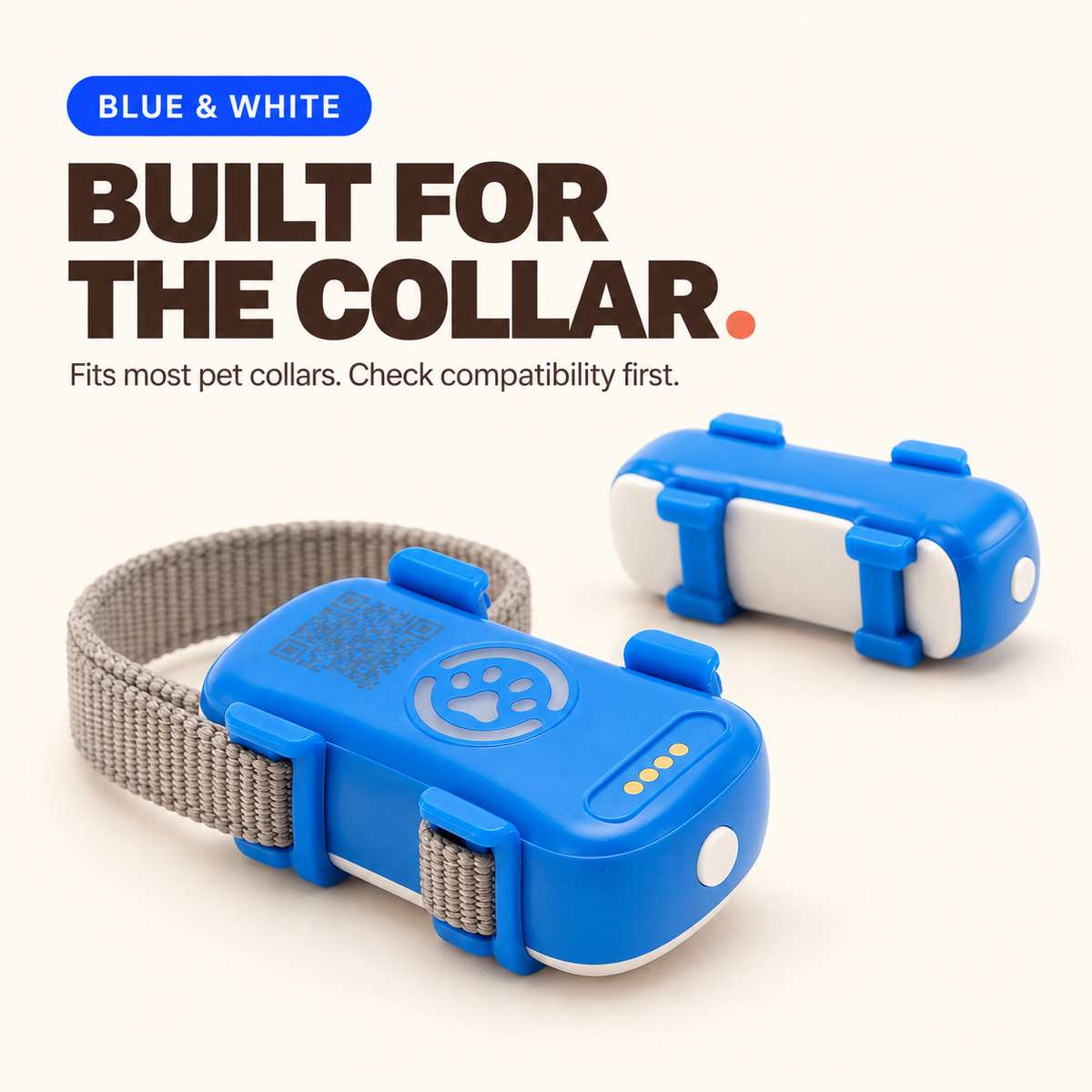 Blue and White dog GPS tracker shown from the front and side with its retaining tabs fitted to a collar strap.