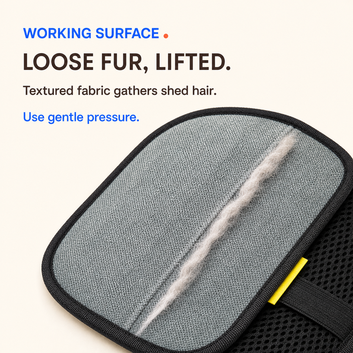 Close-up of the gray grooming surface gathering loose pet fur