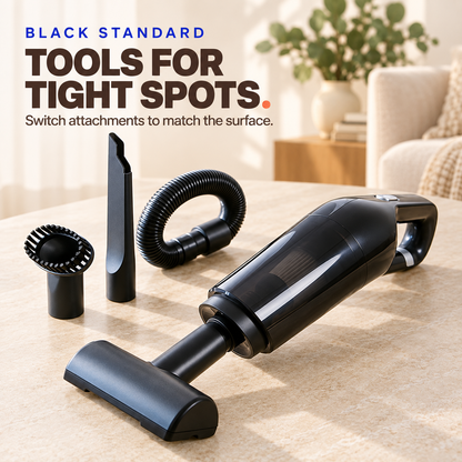 Black cordless pet hair vacuum with floor head, crevice nozzle, flexible hose, and round brush.