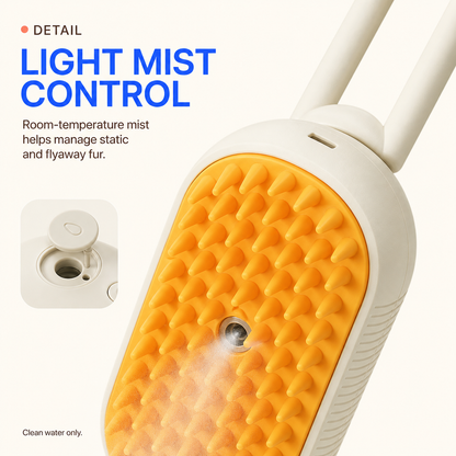Cream misting grooming brush showing orange silicone bristles and central mist nozzle