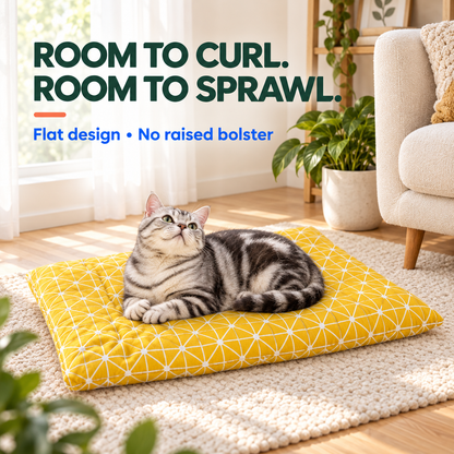 Silver tabby cat rests on the Yellow geometric Plush Winter Pet Bed Mat with room to change positions.