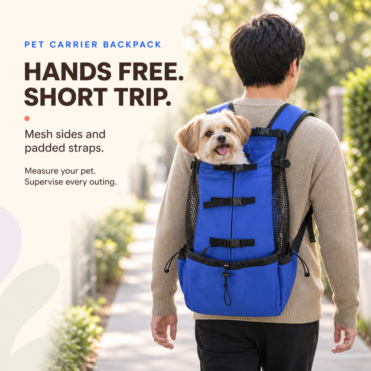 Adult carries a small dog in the Blue pet carrier backpack during a short supervised outing.