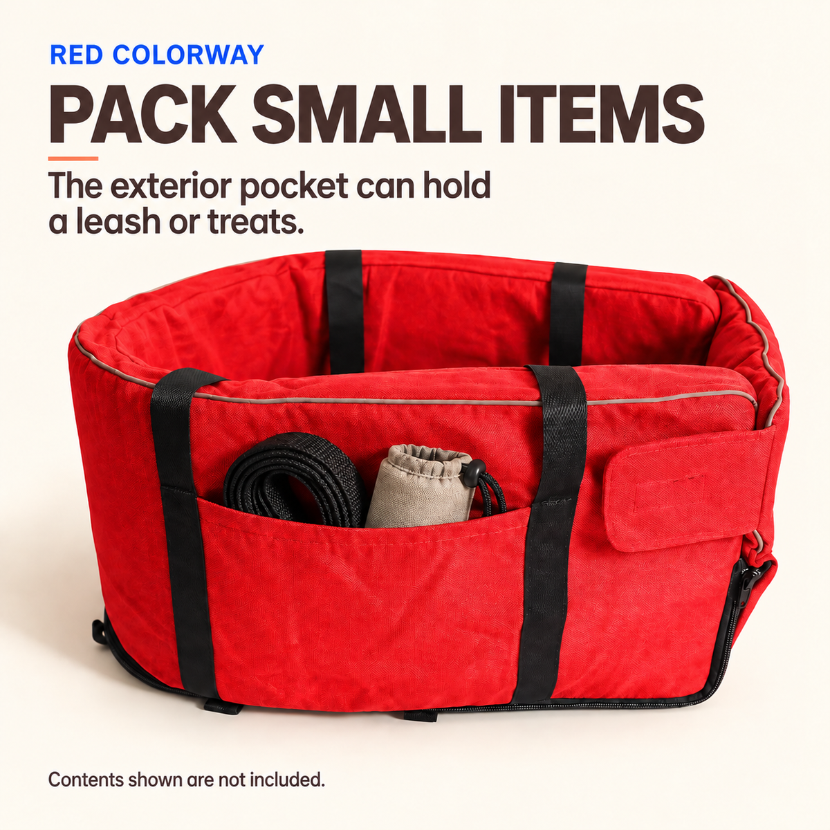 Red pet car travel bed with leash and treat pouch shown in the exterior pocket