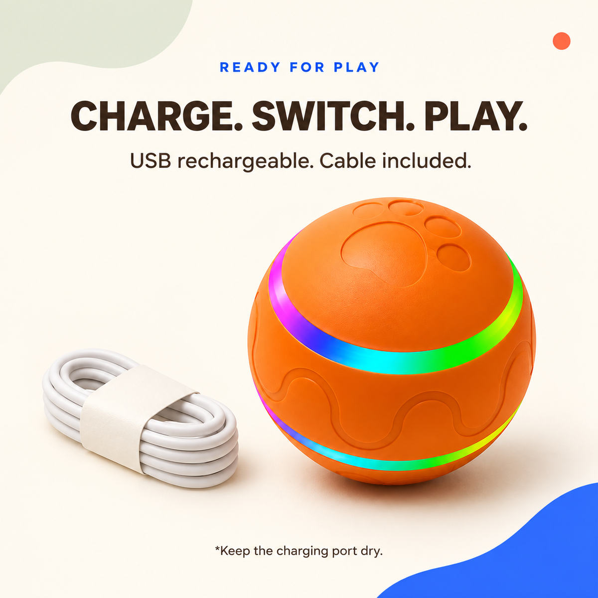 Orange USB-rechargeable automatic cat ball beside its included coiled charging cable