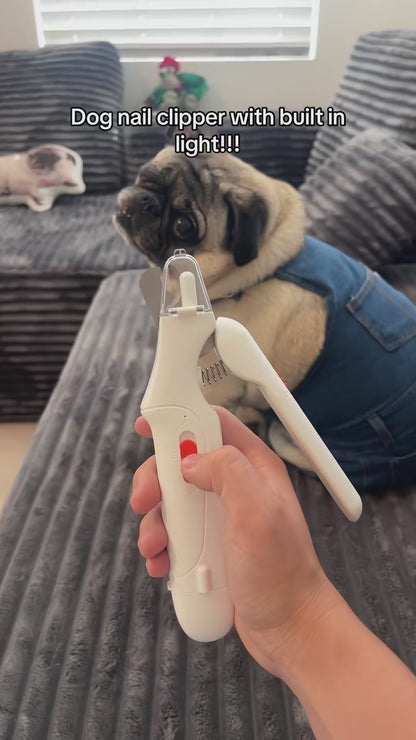 Holding a small dog's paw and trimming a nail with the lit LED Pet Nail Clipper
